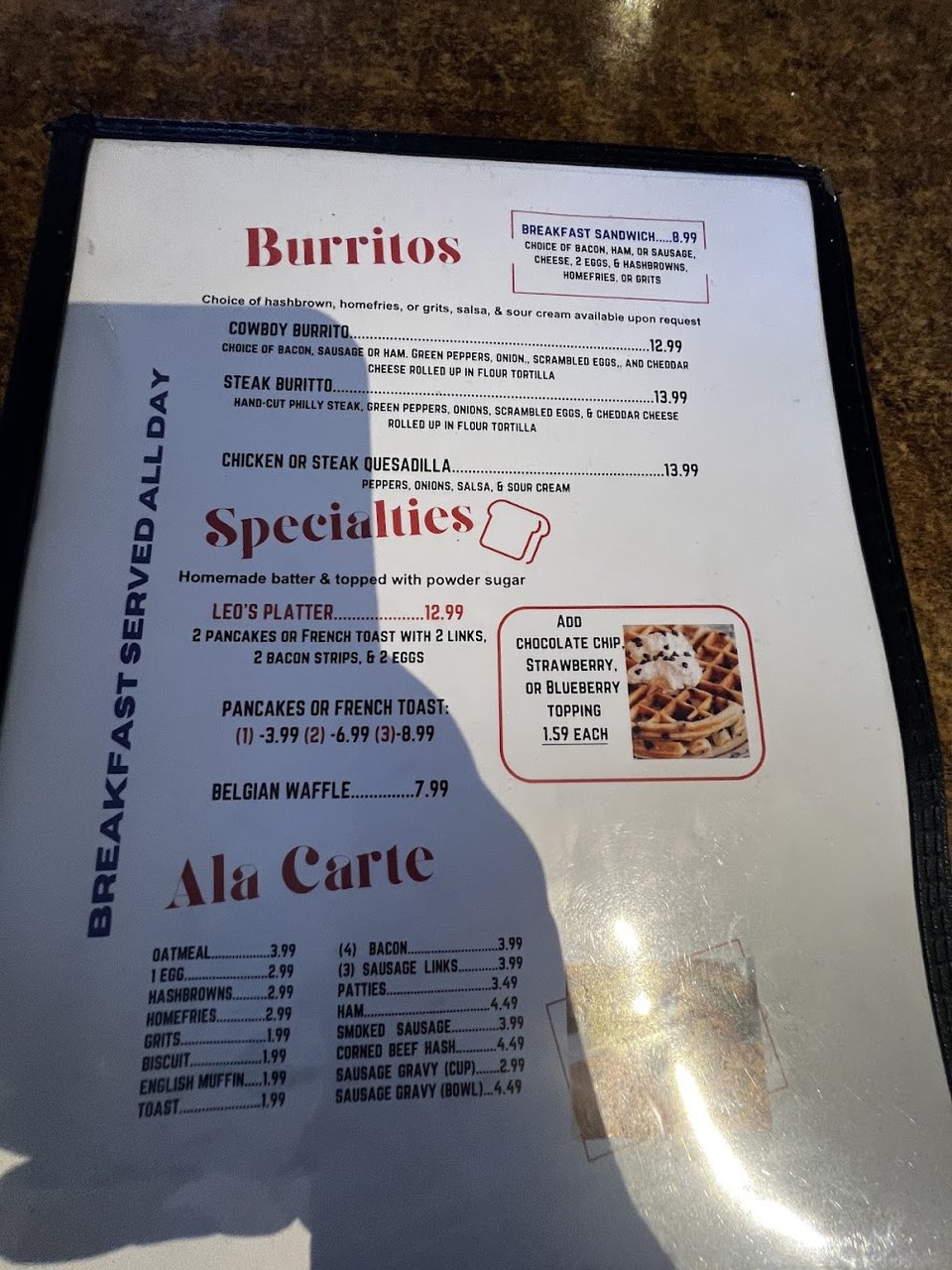 Restaurant menu listing brunch items and drinks.